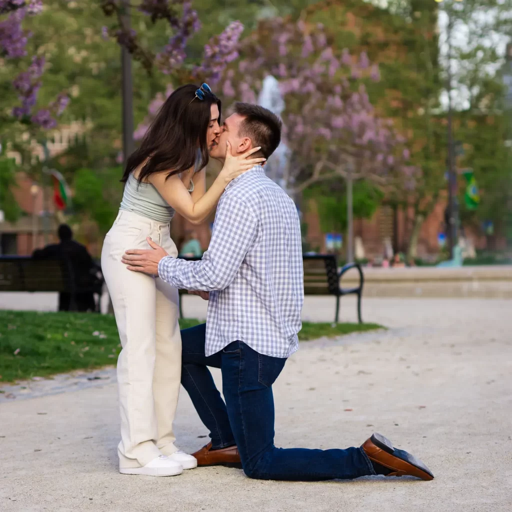 Engagement, man and woman, park, flowers, proposal