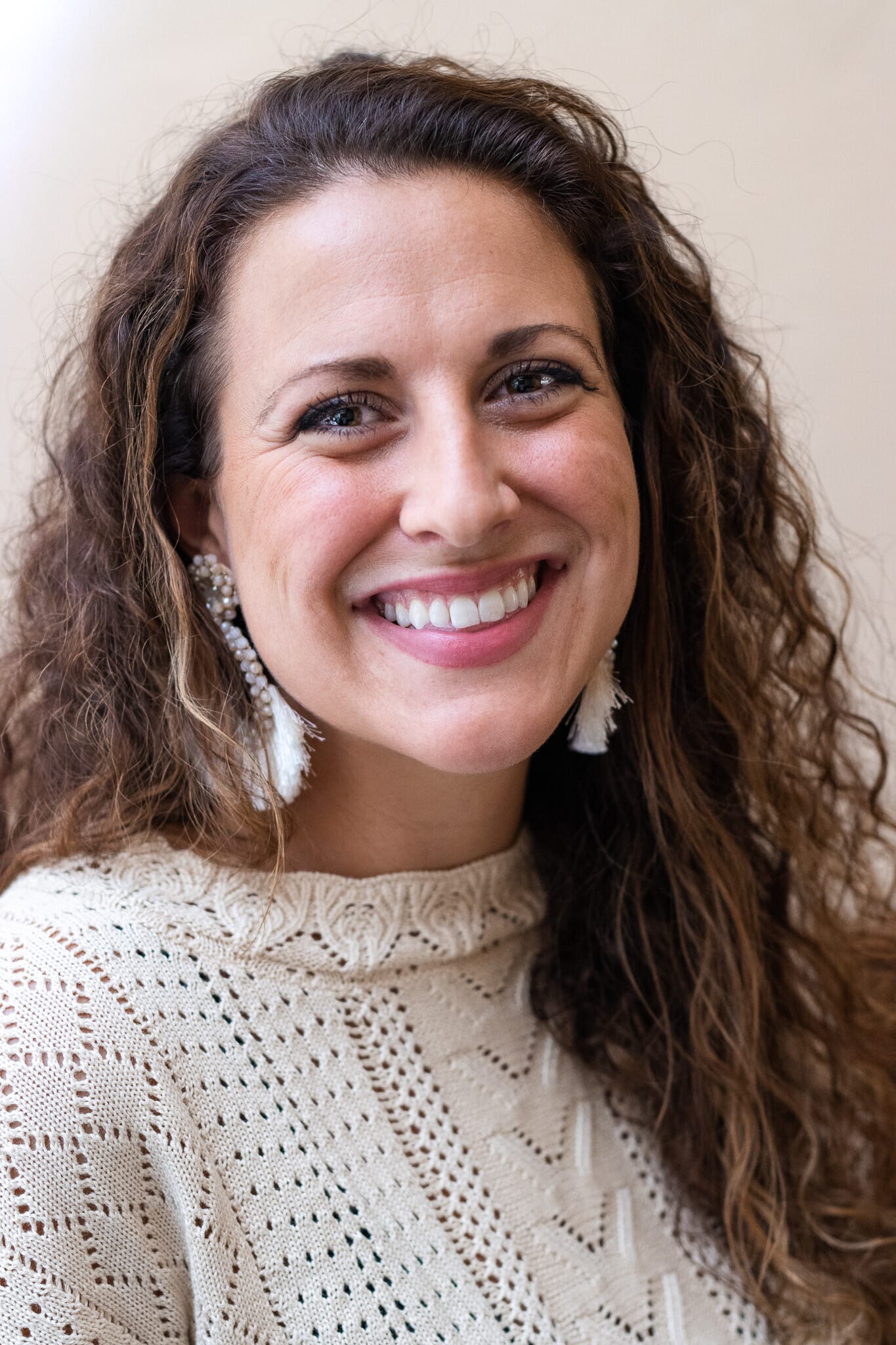 woman headshot, professional, white sweater, business