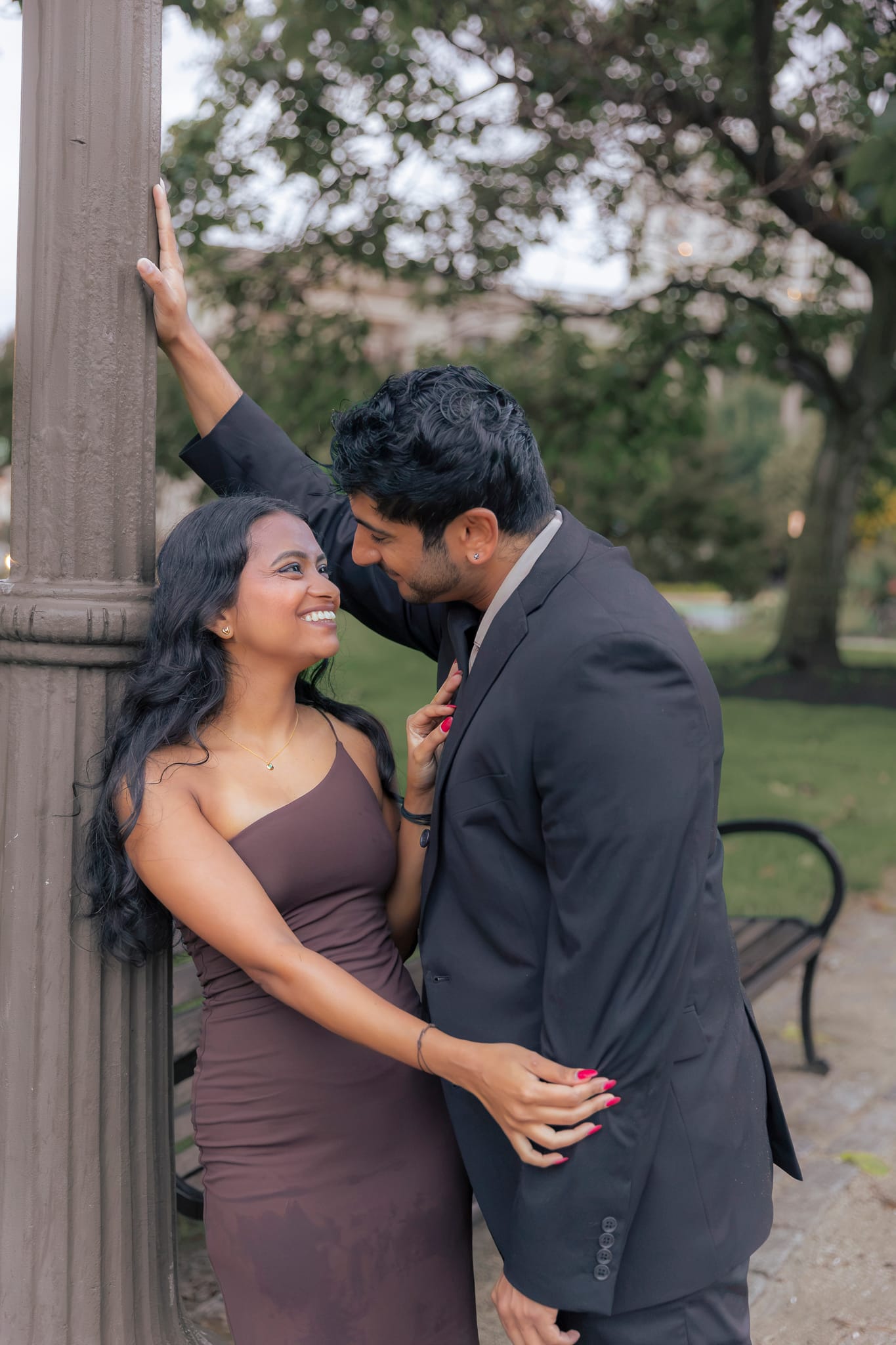 Engaged couple posing at Logan Square in Philadelphia